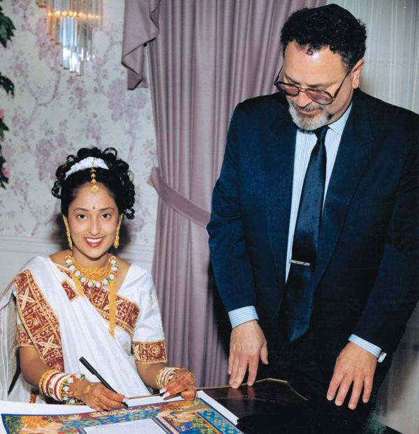 Bet Halevi-Rabbi Mordecai Genn, Ph.D., the bride signs the Ketubah
