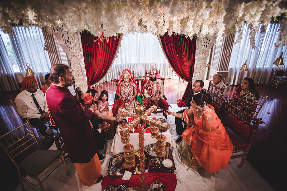 Glamorous Events: The wedding ceremony, where both sets of parents are involved with rituals with the bride and groom. (Christopher Brock Photography)